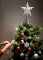 Free photo front view christmas tree with star decoration