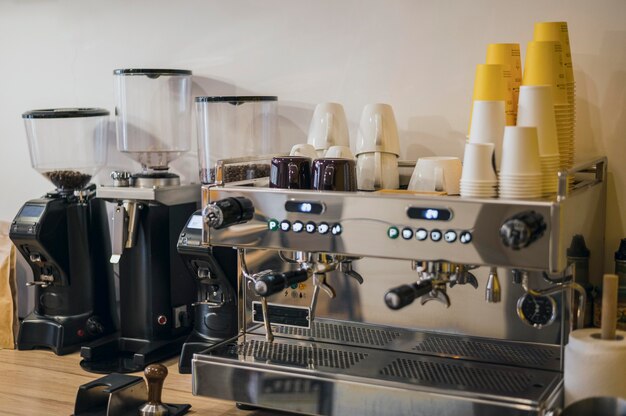 Front view of coffee machine with loads of cups