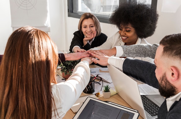 Free photo front view of colleagues with hand united