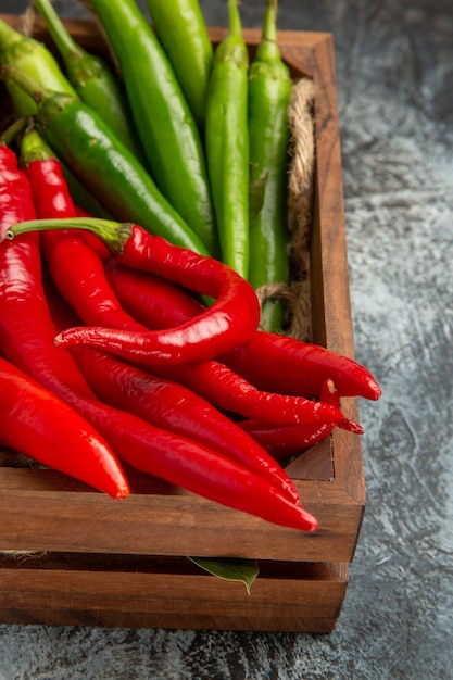 Front view colored spicy peppers inside box