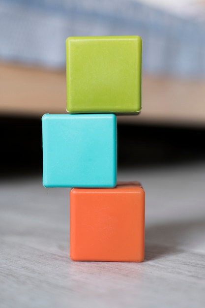 Free photo front view of colored stacked cubes