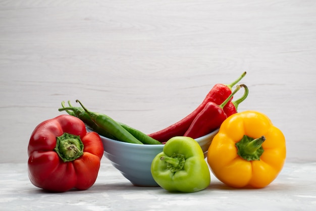 Front view colorful peppers with bell-peppers vegetable pepper color