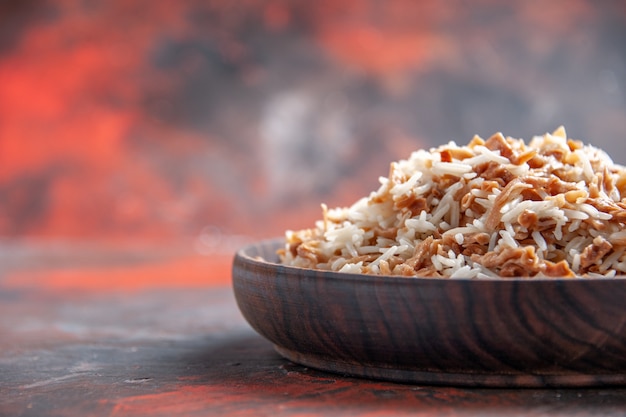 Front view cooked rice with dough slices on a dark surface dish meal dark food photo