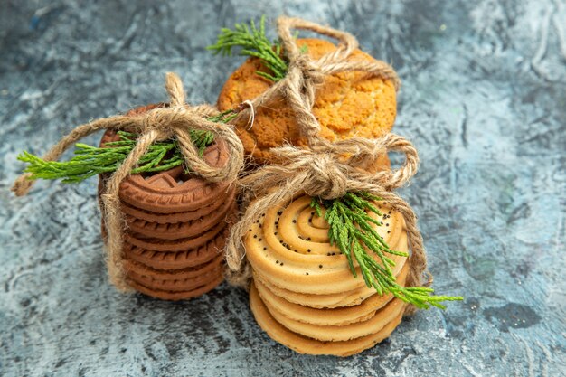 Front view cookies tied with ropes on grey background