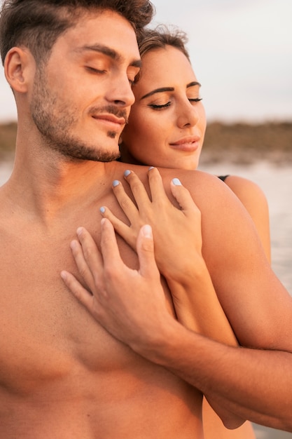 Front view of couple hugging and spending time together