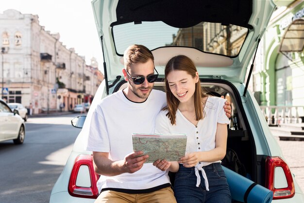 Front view of couple looking at map