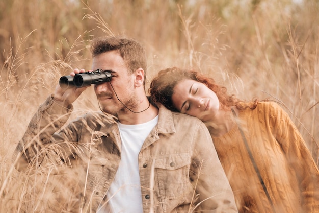 Front view couple standing in wheat field