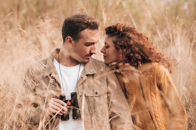 Front view couple standing in wheat field