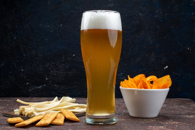 Front view of crisps and chips along with beer on the dark surface