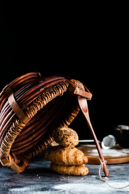 Free Photo front view of croissants and basket on table