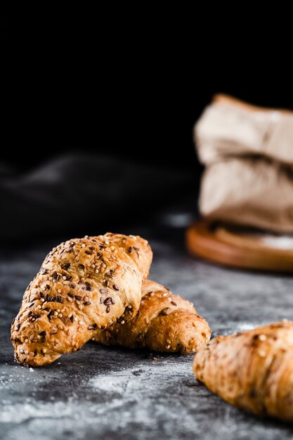 Front view of croissants on black background