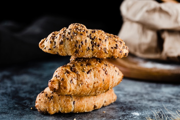 Front view of croissants on black background