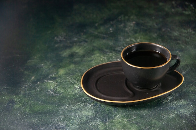 Free photo front view cup of tea in black cup and plate on dark surface sugar ceremony glass breakfast cake dessert color sweets