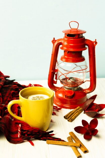 Front view cup of tea with lamp