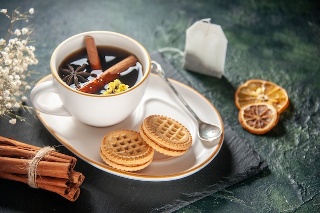 front view cup of tea with sweet biscuits on dark surface bread drink ceremony glass sweet breakfast morning sugar cake color photos