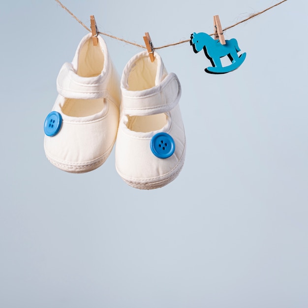 Free photo front view of cute little baby shoes