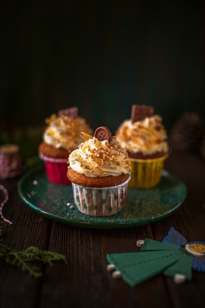 Front view decorated cupcakes with christmas ornaments