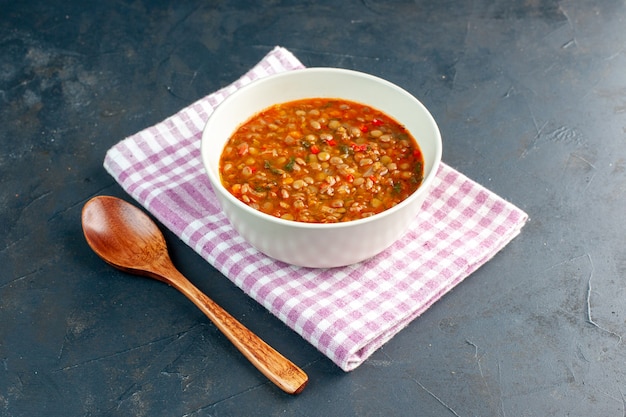 Free photo front view delicious bean soup inside plate on dark background