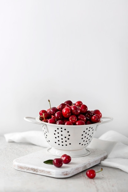 Free photo front view of delicious cherries concept