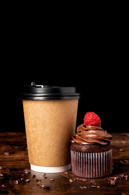 Front view of delicious chocolate cupcakes with raspberry