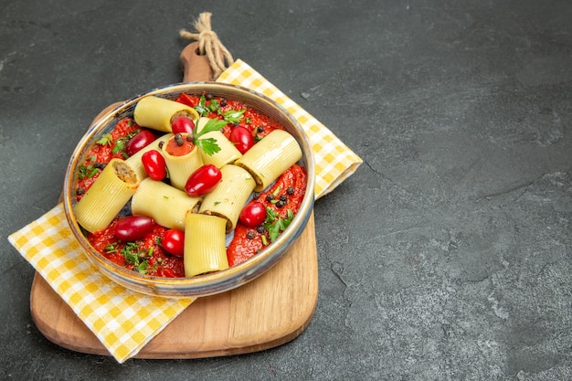 Free Photo front view delicious italian pasta with meat and tomato sauce on grey background pasta meal food dinner meat