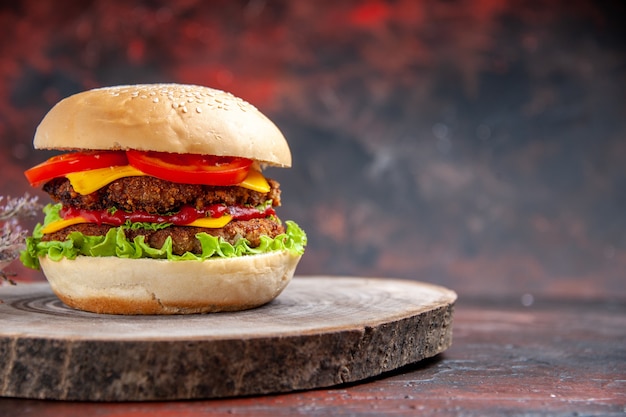 Front view delicious meat burger with cheese on dark background