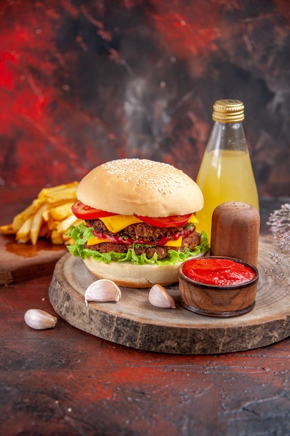 Front view delicious meat burger with french fries on dark floor