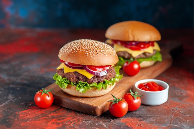 Free photo front view delicious meat cheeseburger on cutting board dark