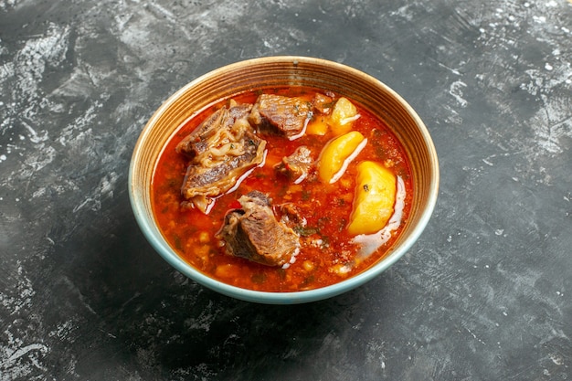 Front view delicious meat soup with potatoes inside plate