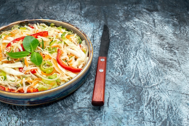 Free Photo front view delicious vegetable salad inside tray on grey table