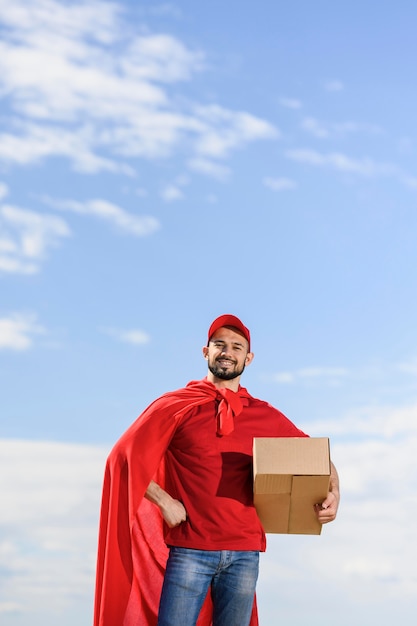 Free photo front view delivery man wearing superhero cape