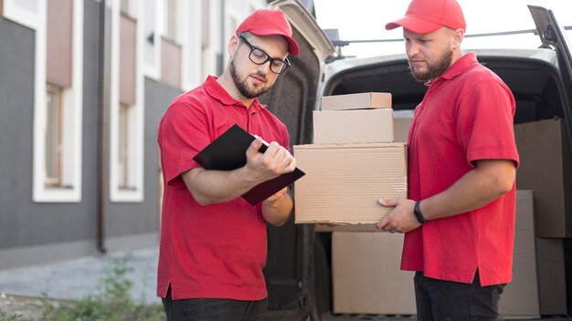 Front view of delivery man with packagaes