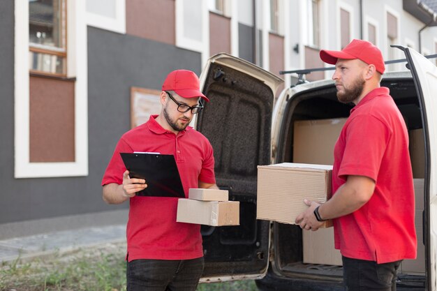 Front view of delivery man with packagaes