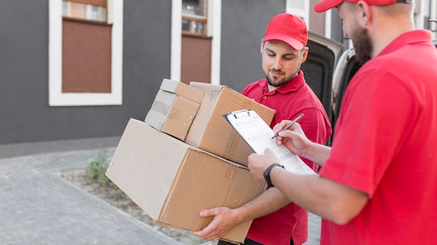 Front view of delivery man with packagaes