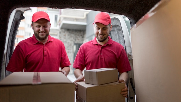 Front view of delivery man with packagaes