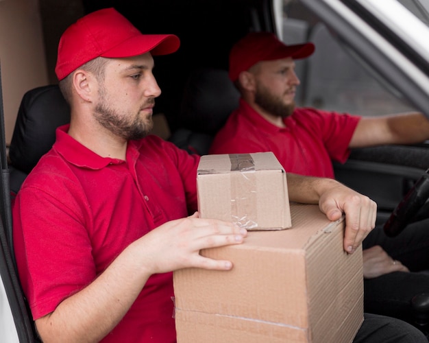 Front view of delivery man with packagaes