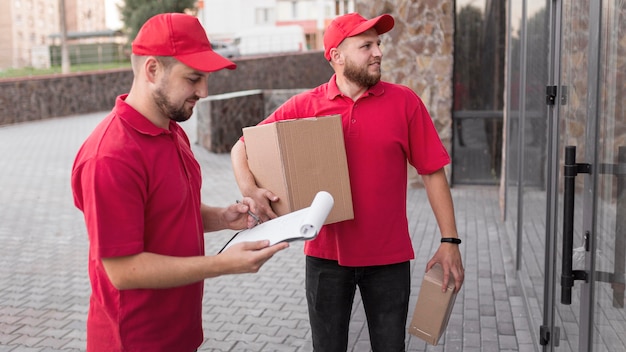 Front view of delivery man with packagaes