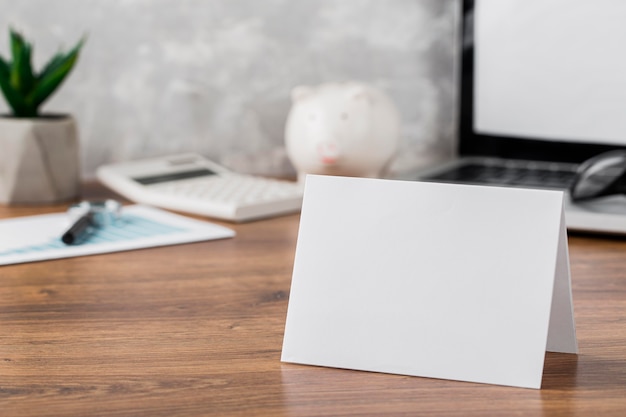 Front view of desk with blank paper