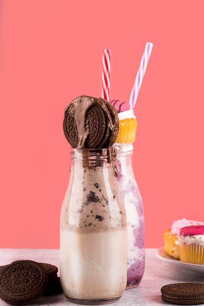 Free photo front view of dessert with biscuits and muffins