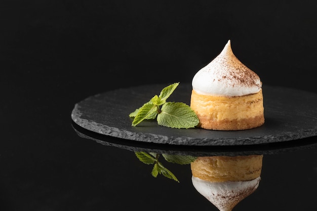 Free photo front view of dessert with powdered cocoa and mint on slate