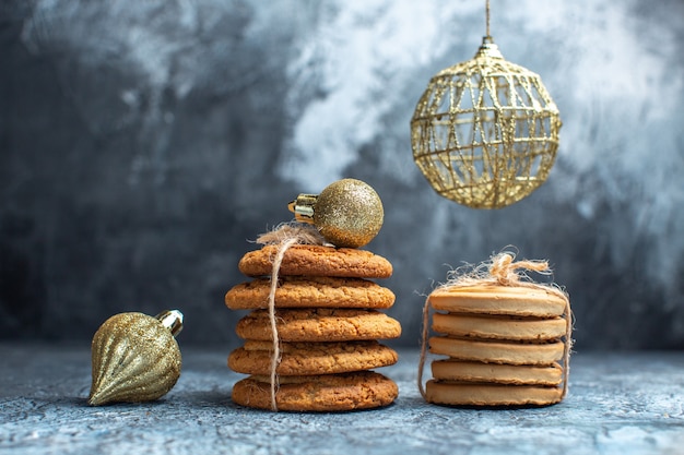 Front view different delicious biscuits on light desk