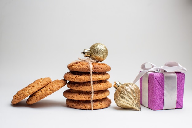 Front view different tasty biscuits on white background