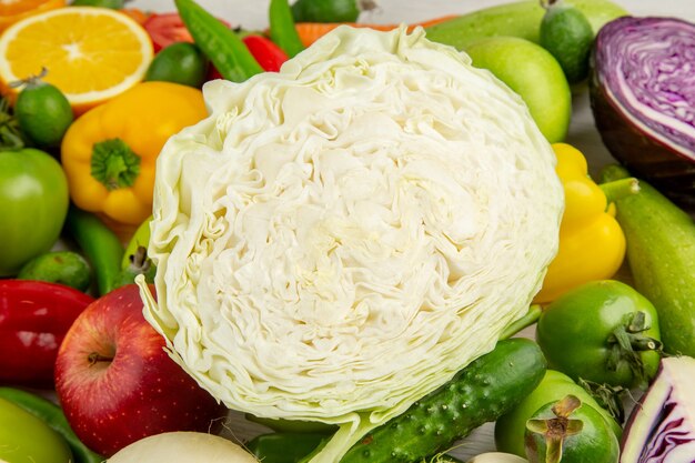 Front view different vegetables with fresh fruits on the white background food diet ripe color photo salad