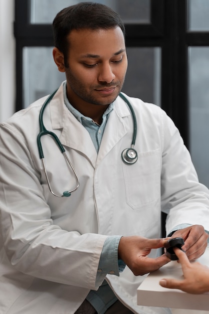 Free Photo front view doctor working at clinic