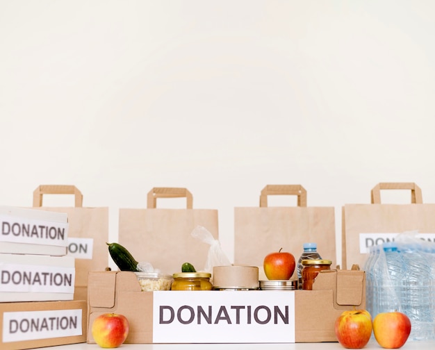 Free photo front view of donation bags and boxes with copy space