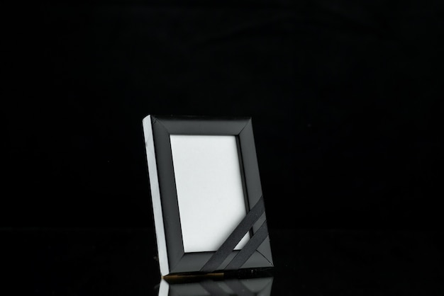 Front view of empty picture frame on dark