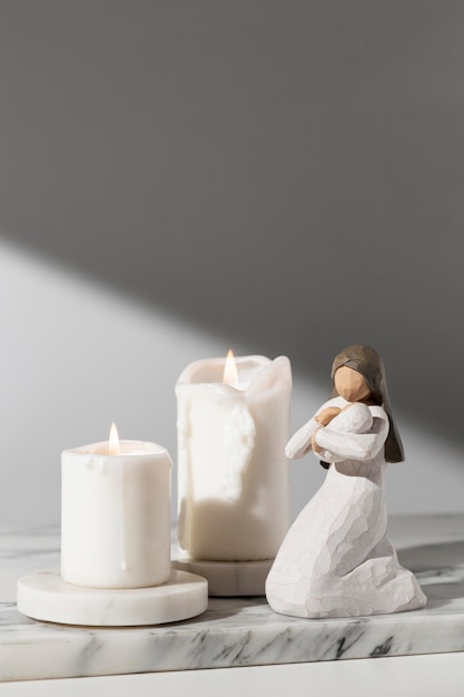 Free photo front view of epiphany day female figurine with candles