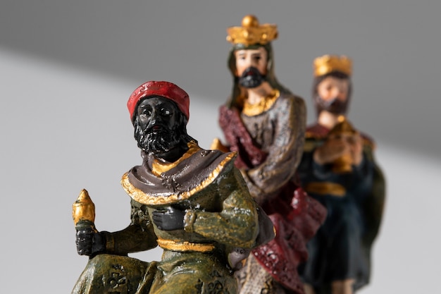 Front view of epiphany day kings figurines with crowns