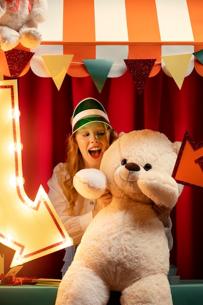 Free photo front view excited woman holding  toy