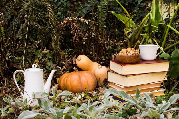 Front view fall season arrangement with pumpkins 